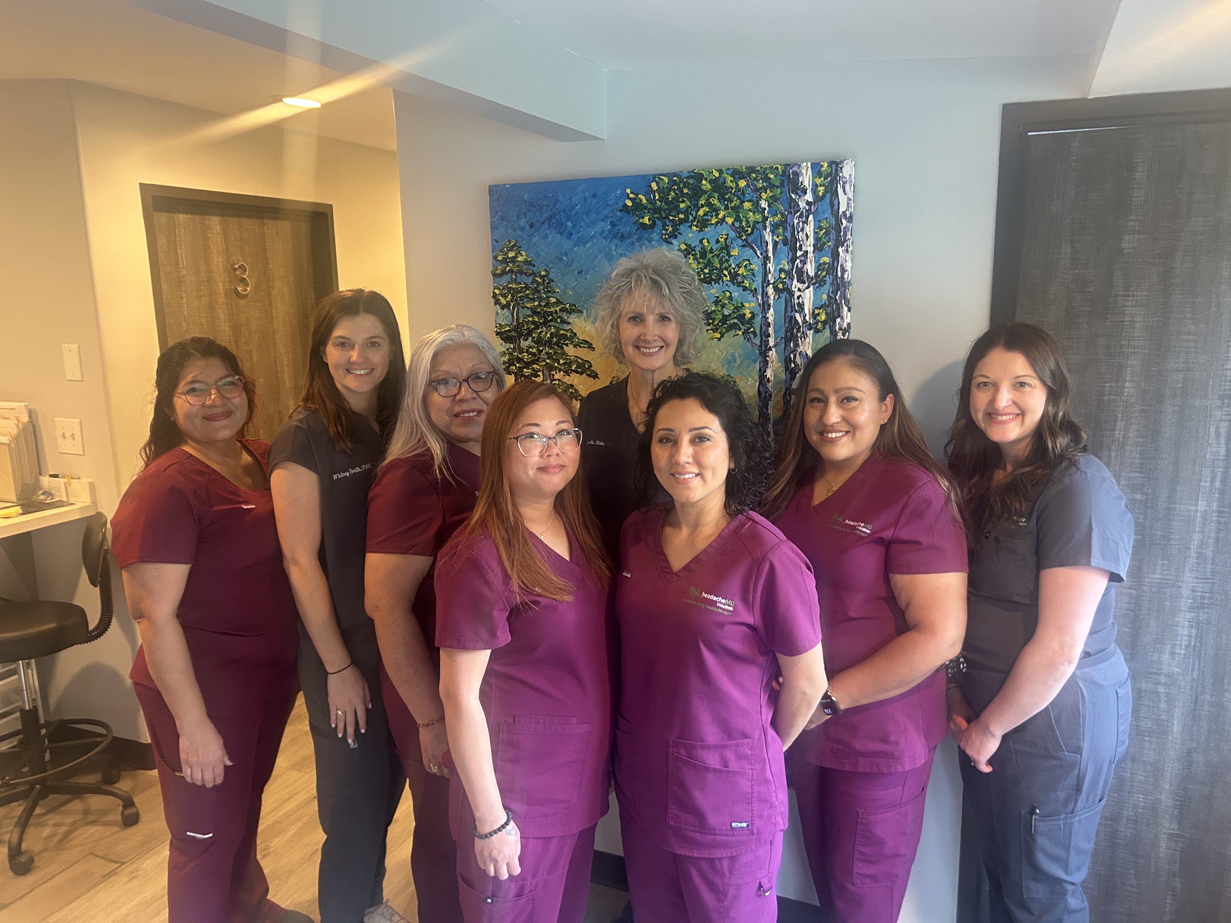 headacheMD Houston team in front of tree painting